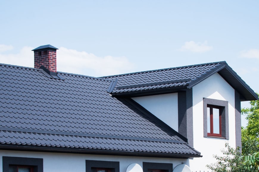 A tiled roof with a chimney